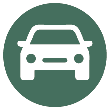 Rund mörkgrön skylt med piktogram för bil.