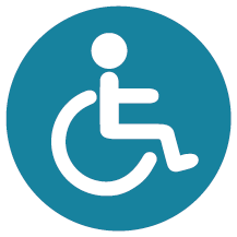 Rund turkos skylt med piktogram för funktionshindrad.