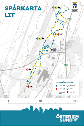 Skylt med karta över skidspåret i Lit. Piktogram med teckenförklaringar beskriver spårets funktionalitet och nyttjande.